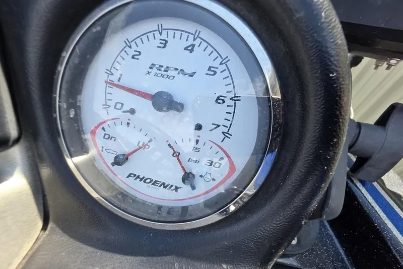 Slide: The Image of Close-up of a 2012 Phoenix 721 ProXP RPM gauge, showing detailed measurements. - 12