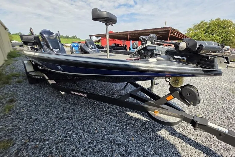 Slide: The Image of 2012 Phoenix 721 ProXP boat on trailer, featuring Minn Kota trolling motor. - 19