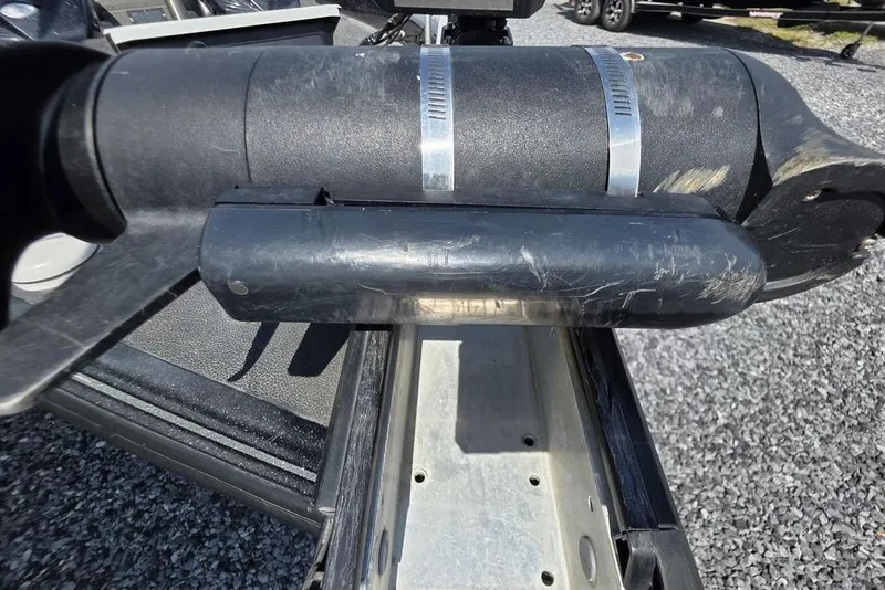 Slide: The Image of Close-up of a 2012 Phoenix 721 ProXP boat component with visible wear and metal clamps. - 20