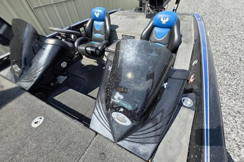 Slide: The Image of 2012 Phoenix 721 ProXP boat interior with dual seats and console. - 23