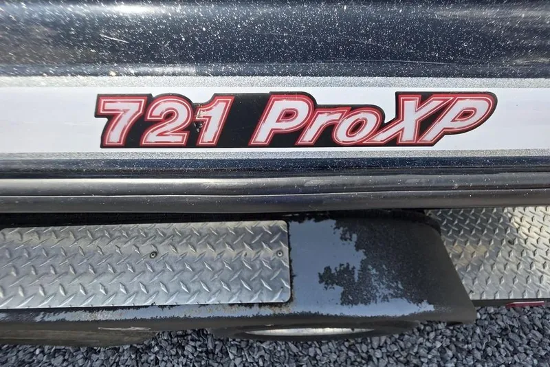 Slide: The Image of Close-up of 2012 Phoenix 721 ProXP boat logo on metallic surface. - 3