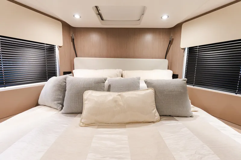 Slide: The Image of Luxurious bedroom interior of 2023 Azimut Fly 50 yacht with plush pillows and modern design. - 101