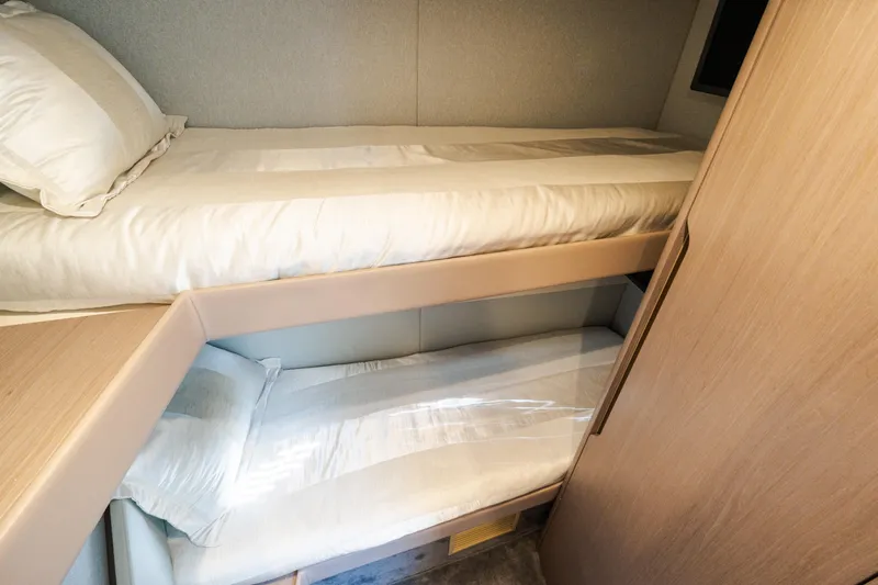 Slide: The Image of 2023 Azimut Fly 50 yacht interior with cozy twin bunk beds. - 105