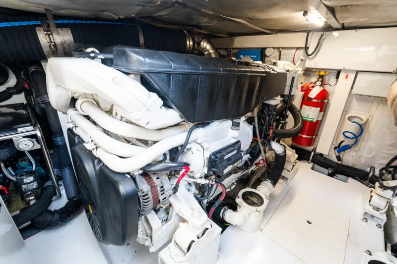 Slide: The Image of Engine room of 2023 Azimut Fly 50 yacht, featuring modern equipment and fire extinguisher. - 115