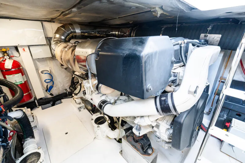 Slide: The Image of Engine room of 2023 Azimut Fly 50 yacht, featuring modern machinery and fire safety equipment. - 116