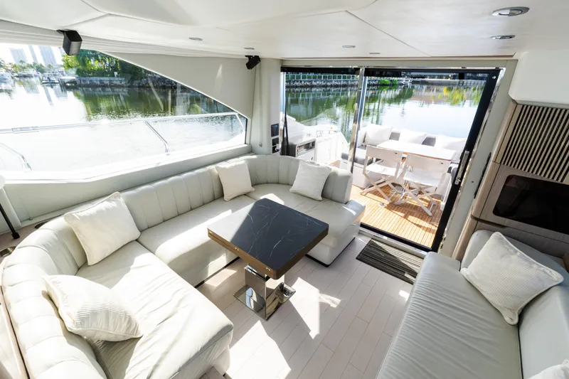 Slide: The Image of Luxurious interior of 2023 Azimut Fly 50 yacht with elegant seating and scenic water view. - 68