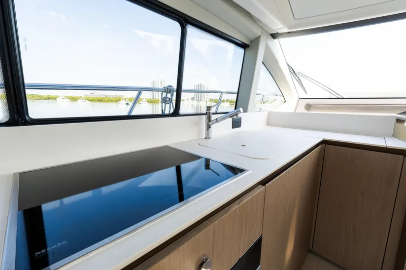 Slide: The Image of Modern kitchen interior on 2023 Azimut Fly 50 yacht, featuring sleek design and scenic window view. - 72