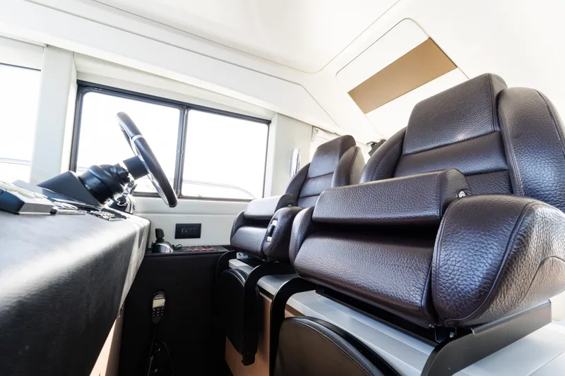 Slide: The Image of Interior of 2023 Azimut Fly 50 yacht with luxurious leather seating and modern controls. - 75