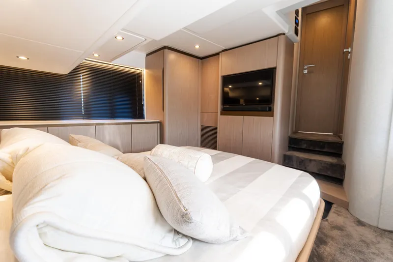 Slide: The Image of Luxurious bedroom interior of 2023 Azimut Fly 50 yacht, featuring modern design and cozy bedding. - 88