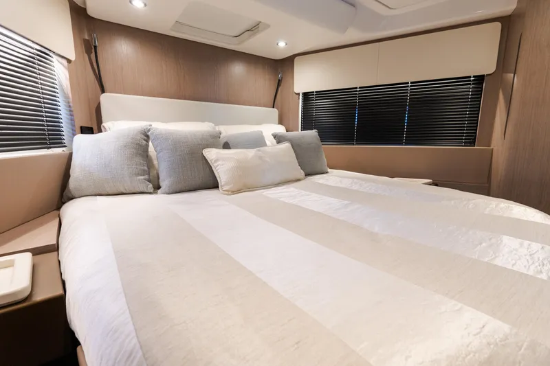 Slide: The Image of Luxurious bedroom interior of 2023 Azimut Fly 50 yacht with elegant bedding and modern design. - 98
