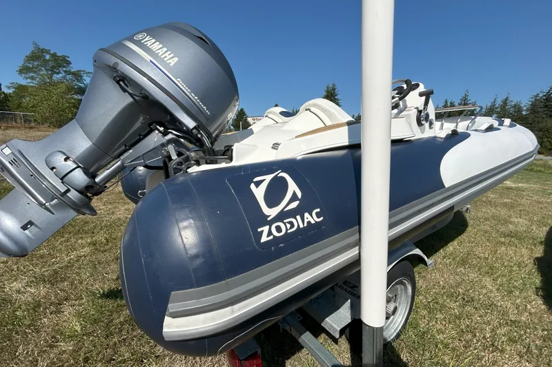 Slide: The Image of 2016 Zodiac Yachtline 420 inflatable boat with Yamaha outboard motor on trailer. - 6