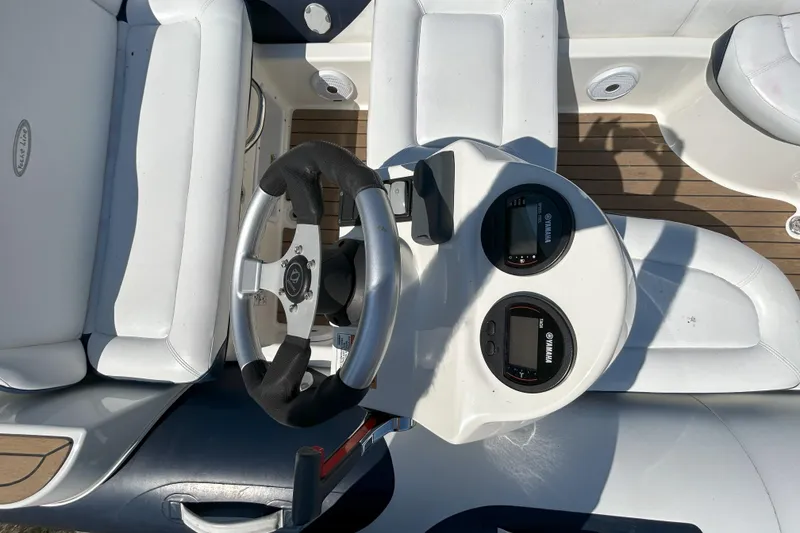 Slide: The Image of 2016 Zodiac Yachtline 420 boat dashboard with steering wheel and Yamaha gauges. - 7