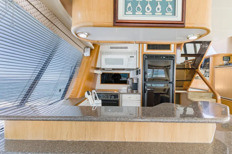 Slide: The Image of Luxurious kitchen interior of 1997 Bayliner 4788 Pilot House Motoryacht with modern appliances. - 10