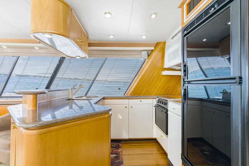 Slide: The Image of Luxurious kitchen interior of 1997 Bayliner 4788 Pilot House Motoryacht with modern appliances. - 12