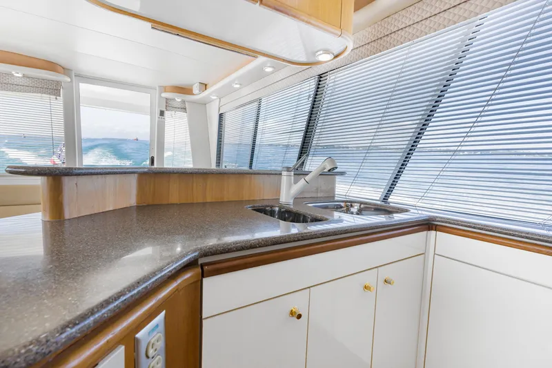 Slide: The Image of Luxurious kitchen interior of 1997 Bayliner 4788 Pilot House Motoryacht with ocean view. - 14