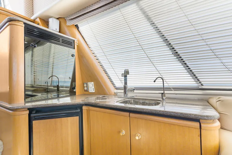 Slide: The Image of 1997 Bayliner 4788 Pilot House Motoryacht kitchen with sleek countertops and modern fixtures. - 15