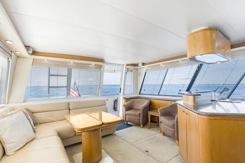 Slide: The Image of Luxurious interior of 1997 Bayliner 4788 Pilot House Motoryacht with ocean view. - 19