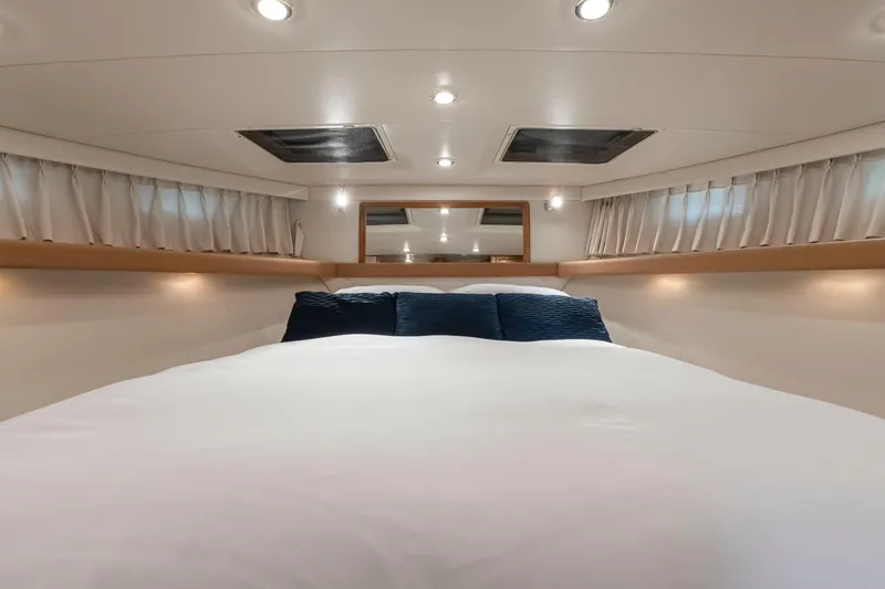 Slide: The Image of Luxurious bedroom interior of 1997 Bayliner 4788 Pilot House Motoryacht with elegant bedding. - 32
