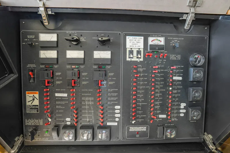 Slide: The Image of Electrical control panel of a 1997 Bayliner 4788 Pilot House Motoryacht with various switches and gauges. - 41