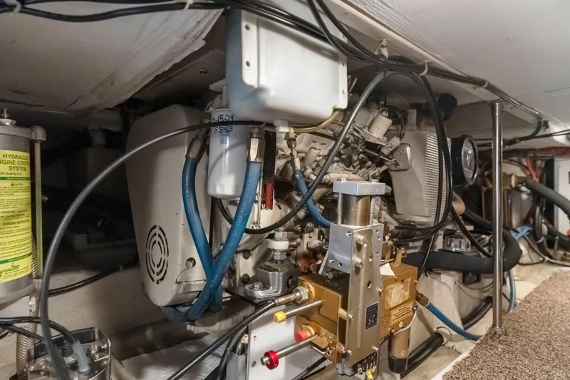 Slide: The Image of Engine room of 1997 Bayliner 4788 Pilot House Motoryacht with hydraulic system components. - 43