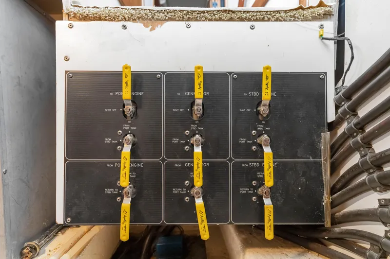 Slide: The Image of Control panel with yellow levers on a 1997 Bayliner 4788 Pilot House Motoryacht. - 47