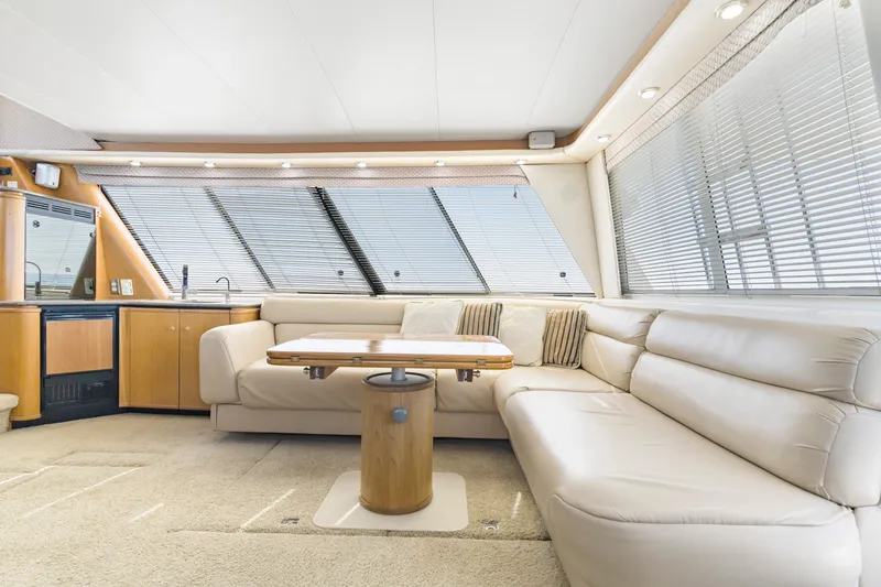 Slide: The Image of Luxurious interior of 1997 Bayliner 4788 Pilot House Motoryacht with plush seating and modern design. - 9