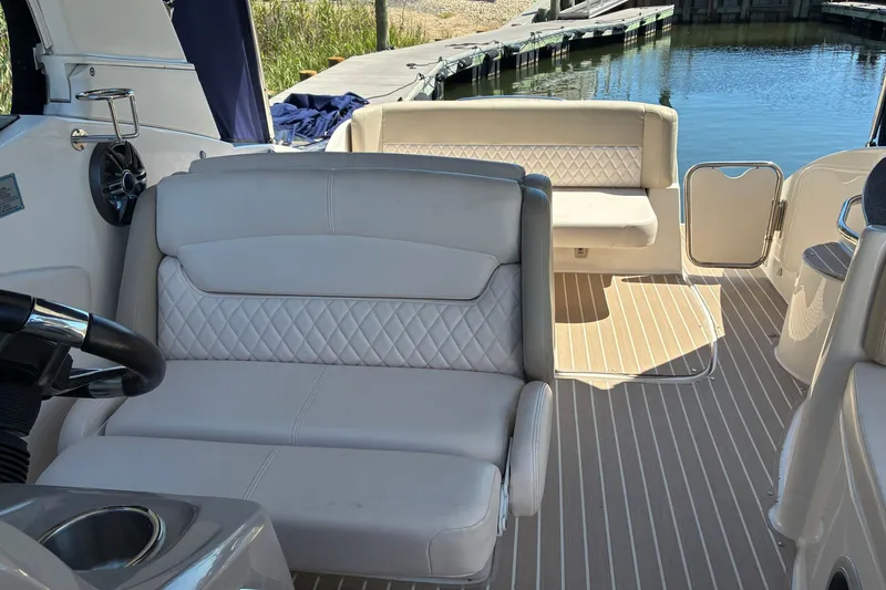 Slide: The Image of 2018 Chaparral 270 Signature boat interior with plush seating and elegant design. - 11