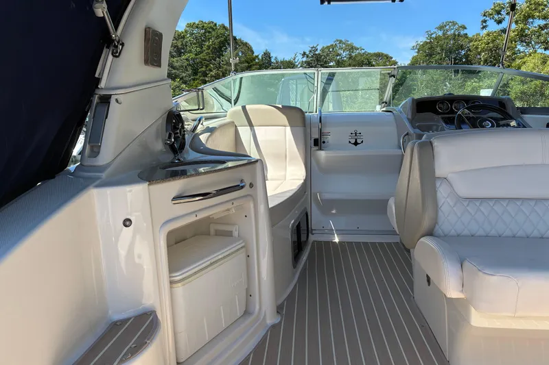 Slide: The Image of 2018 Chaparral 270 Signature boat interior with seating and helm, featuring modern design. - 9