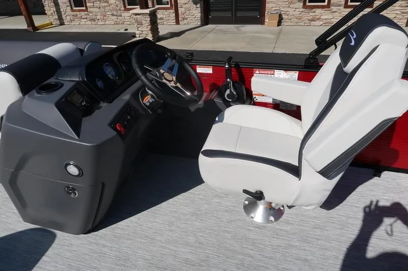 Slide: The Image of 2026 Bennington S Swingback 22 SSB SPS boat interior with captain's chair and control panel. - 10