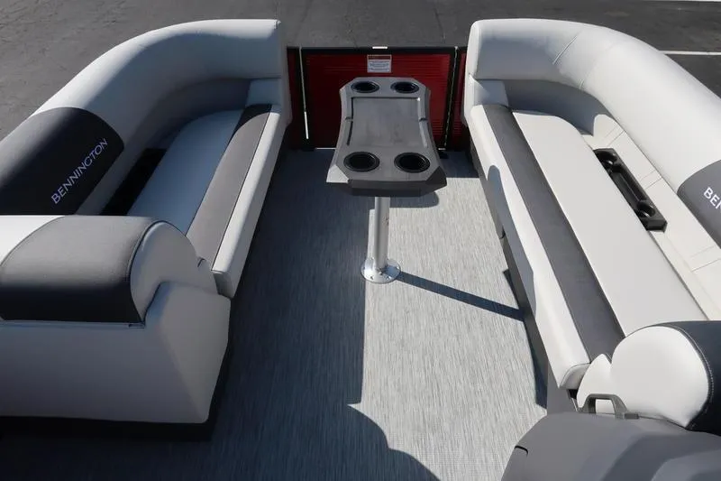 Slide: The Image of 2026 Bennington S Swingback 22 SSB SPS interior with seating and table, featuring cup holders. - 18