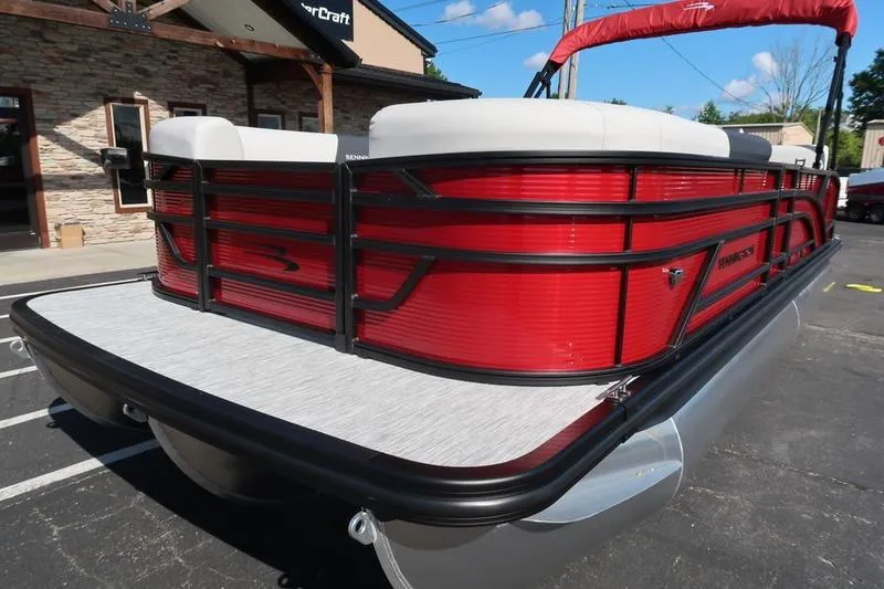Slide: The Image of 2026 Bennington S Swingback 22 SSB SPS pontoon boat with red exterior and sleek design. - 8
