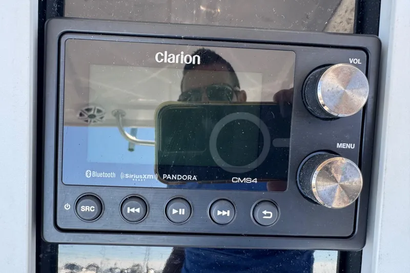 Slide: The Image of Clarion CMS4 audio system on 2008 Donzi 32 ZF Open boat dashboard. - 11