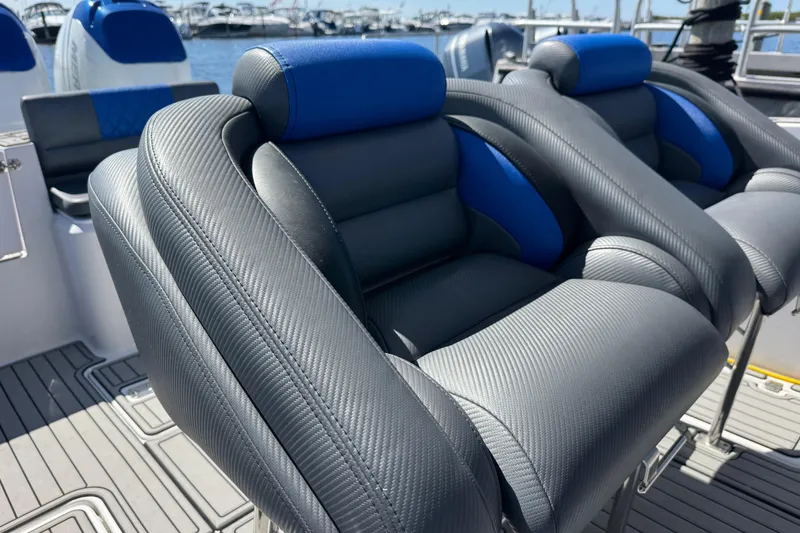 Slide: The Image of Luxury seating on a 2008 Donzi 32 ZF Open boat, featuring sleek design and blue accents. - 15