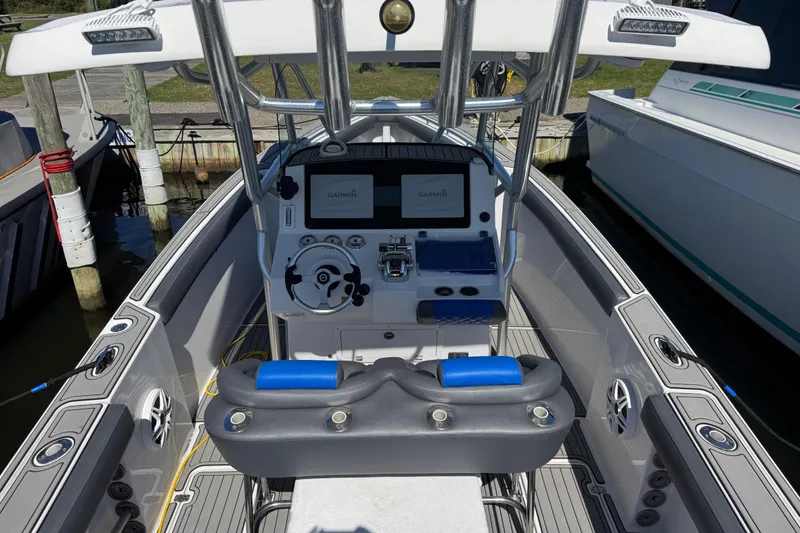 Slide: The Image of 2008 Donzi 32 ZF Open boat cockpit with steering wheel and Garmin displays. - 5