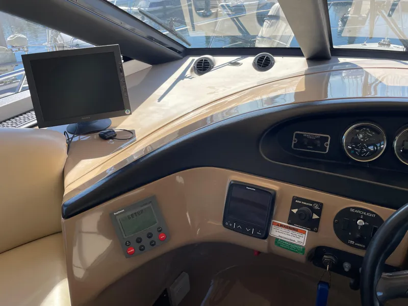 Slide: The Image of Interior view of 2000 Carver 530 Voyager Pilothouse dashboard with navigation equipment. - 14