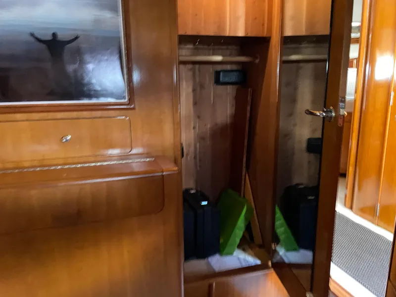 Slide: The Image of Interior of 2000 Carver 530 Voyager Pilothouse with wooden cabinetry and mirrored closet. - 24