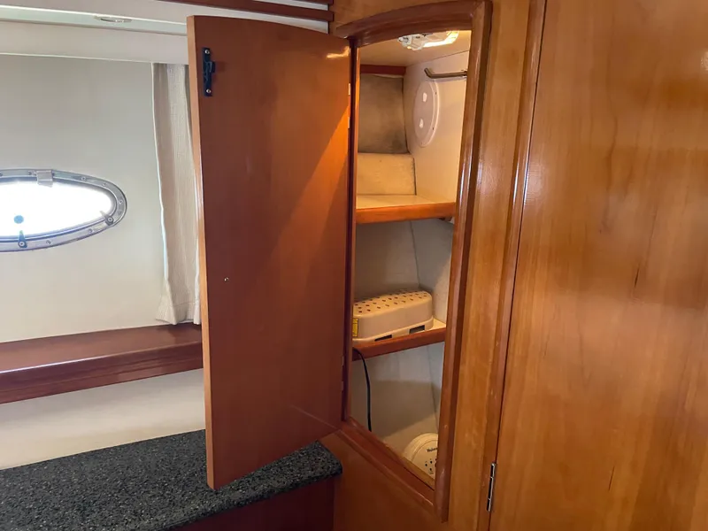 Slide: The Image of Wooden cabinet interior on 2000 Carver 530 Voyager Pilothouse yacht. - 33