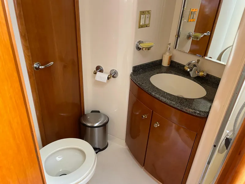Slide: The Image of Bathroom interior of 2000 Carver 530 Voyager Pilothouse yacht with sink and toilet. - 38