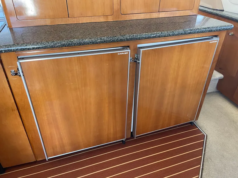 Slide: The Image of Wooden cabinetry in a 2000 Carver 530 Voyager Pilothouse yacht interior. - 9