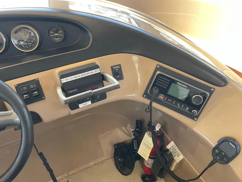 Slide: The Image of Control panel of 2000 Carver 530 Voyager Pilothouse with gauges and radio equipment. - 15