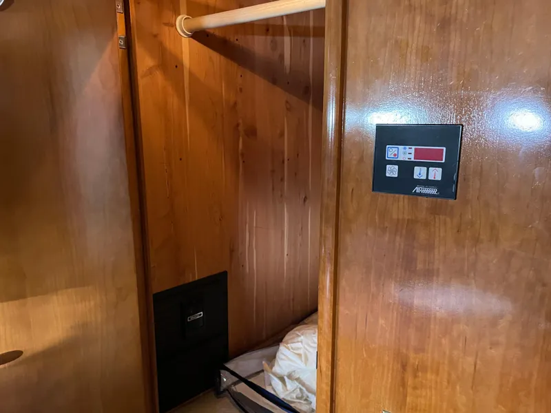 Slide: The Image of Wood-paneled interior of 2000 Carver 530 Voyager Pilothouse with control panel. - 26