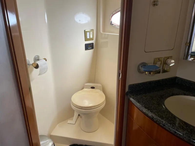 Slide: The Image of Bathroom interior of 2000 Carver 530 Voyager Pilothouse yacht with toilet and sink. - 28