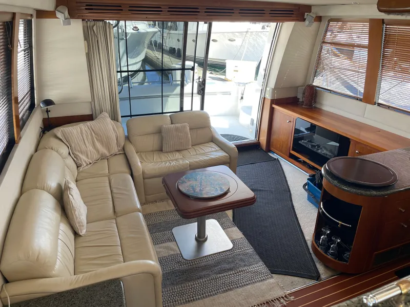 Slide: The Image of Luxurious interior of 2000 Carver 530 Voyager Pilothouse yacht with leather seating. - 3