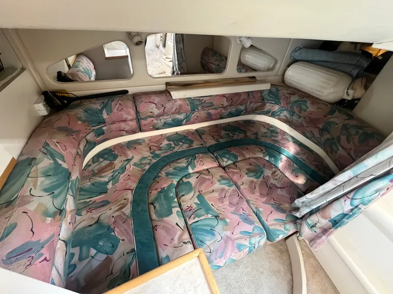 Slide: The Image of Interior of 1996 Cruisers Yachts 3375 with floral-patterned seating and mirrors. - 8