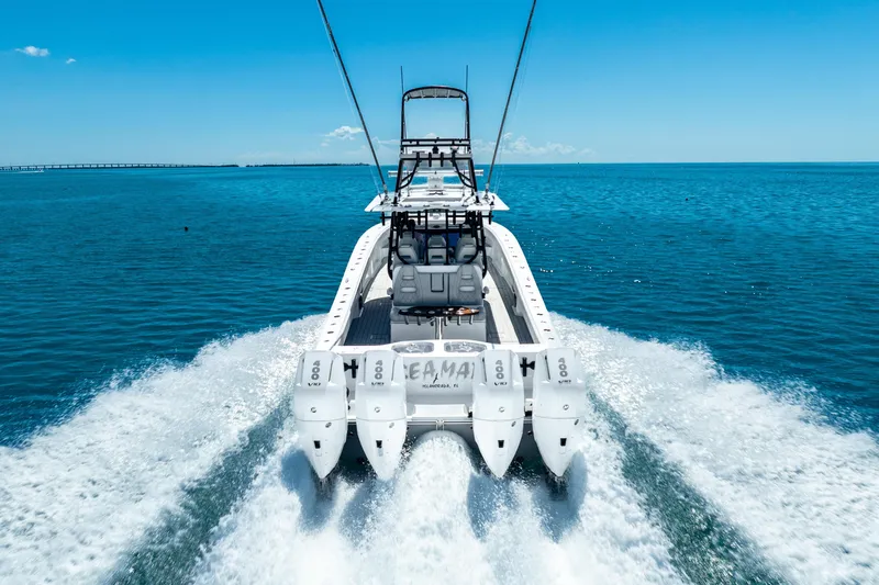 Slide: The Image of 2024 Freeman 42 boat cruising on open water with powerful engines. - 17