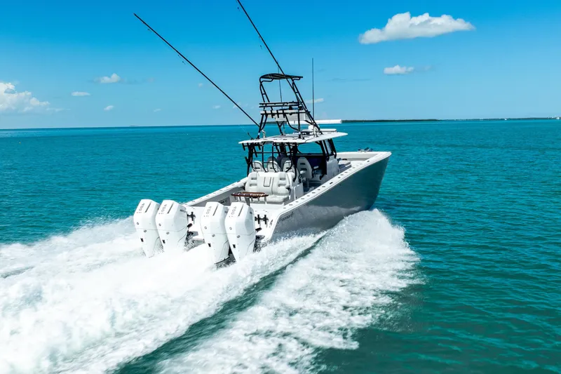 Slide: The Image of 2024 Freeman 42 boat cruising on clear blue ocean waters. - 18