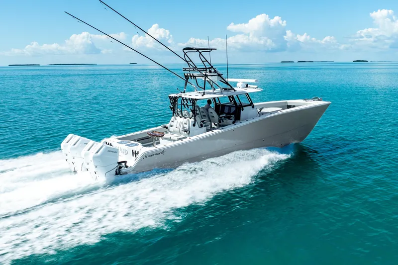 Slide: The Image of 2024 Freeman 42 boat cruising on clear blue ocean waters. - 19