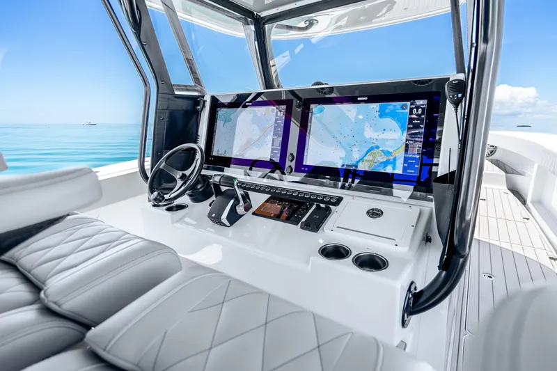 Slide: The Image of Luxurious 2024 Freeman 42 boat cockpit with advanced navigation displays and plush seating. - 23