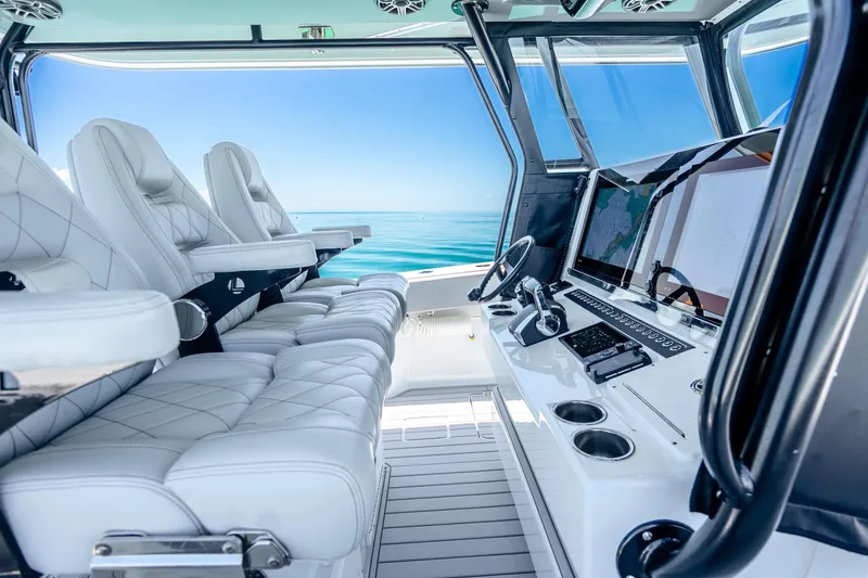 Slide: The Image of Luxurious interior of 2024 Freeman 42 boat with plush seating and advanced navigation system. - 24
