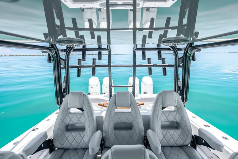 Slide: The Image of 2024 Freeman 42 boat interior with luxurious seating and ocean view. - 29